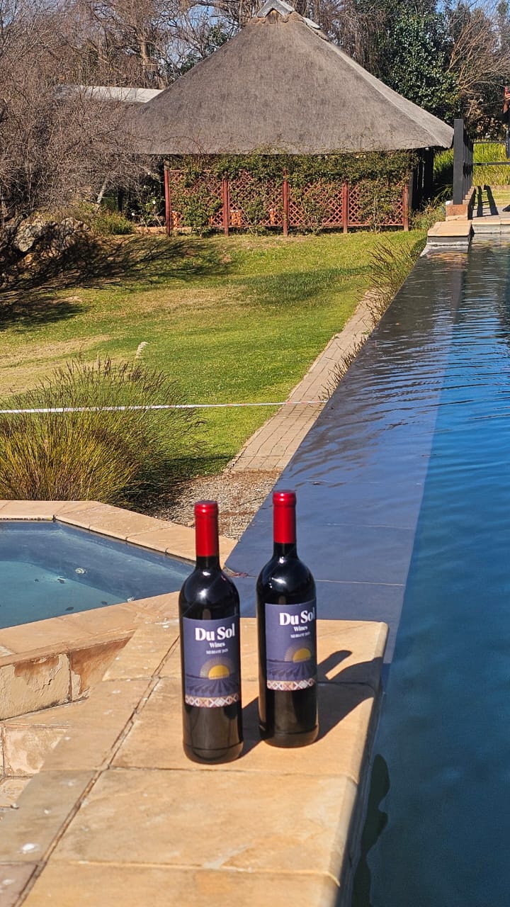 Du Sol reds beside a garden infinity pool and fountain