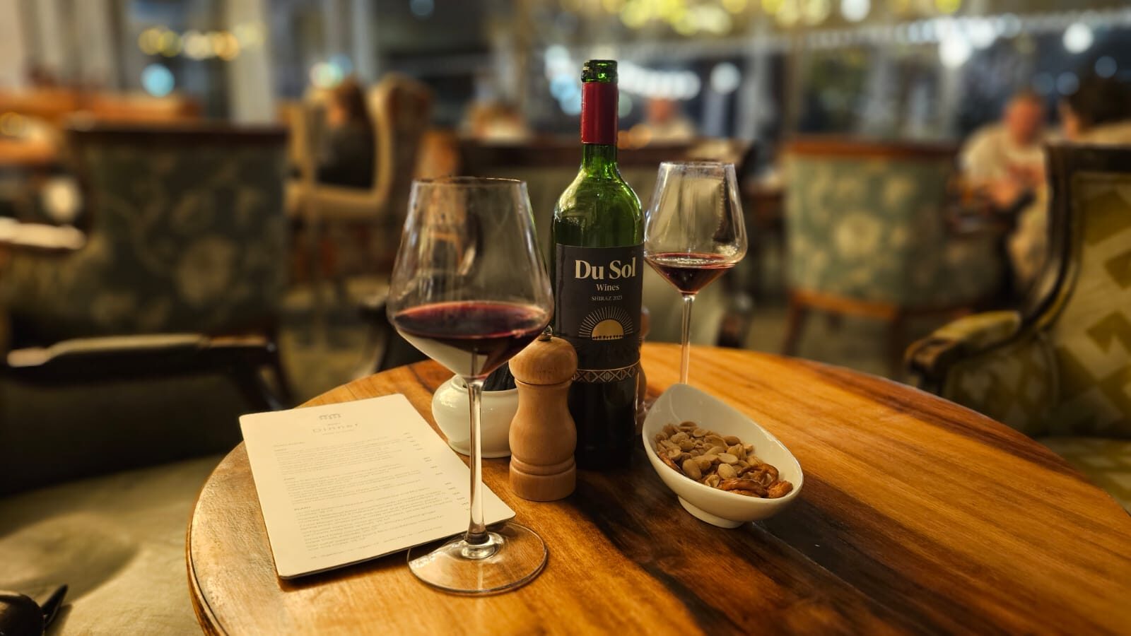 Du Sol Shiraz and Sauvignon Blanc with a spread of snacks at a waterfront table