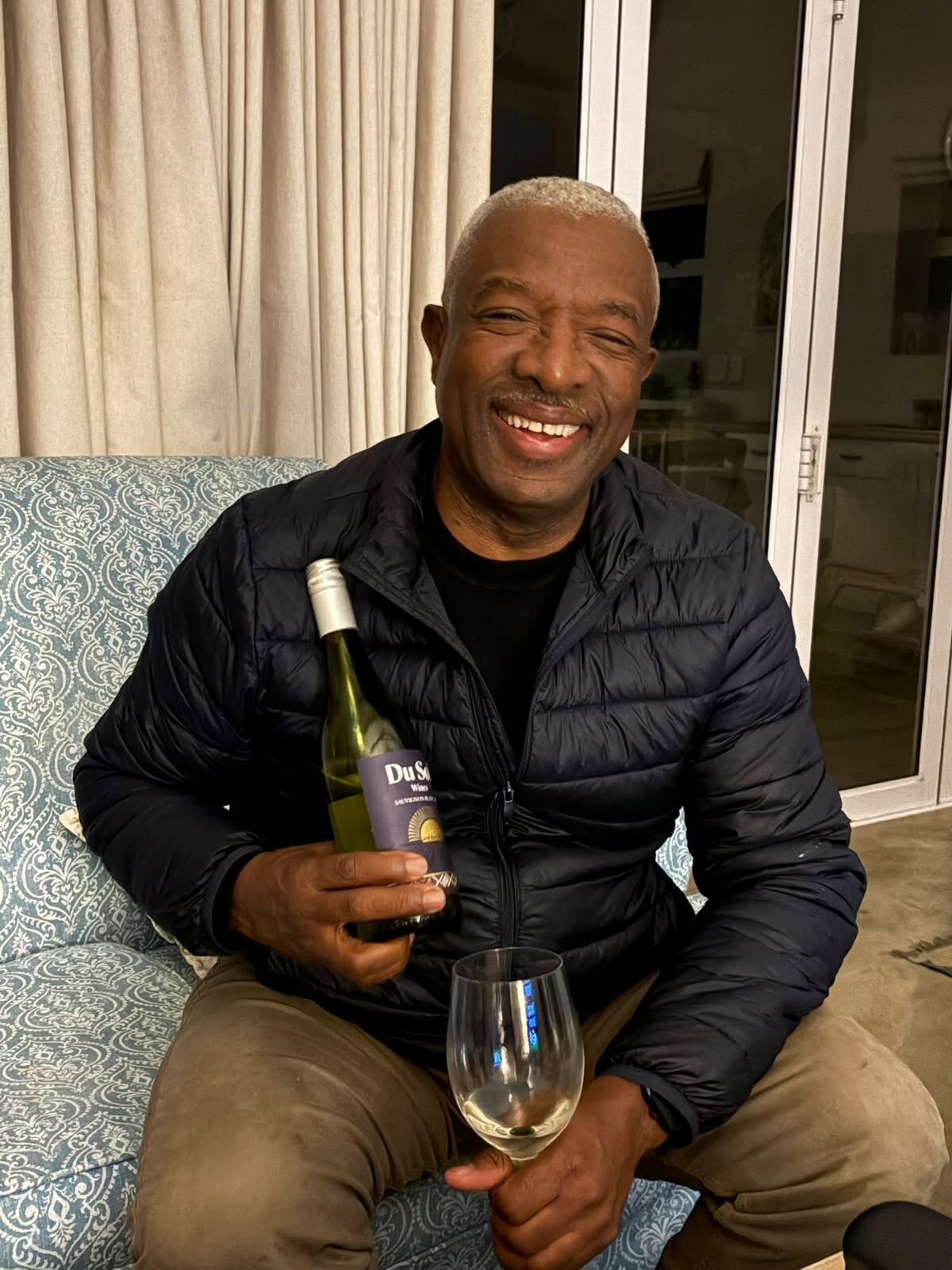 Solly raising a glass of Du Sol Sauvignon Blanc