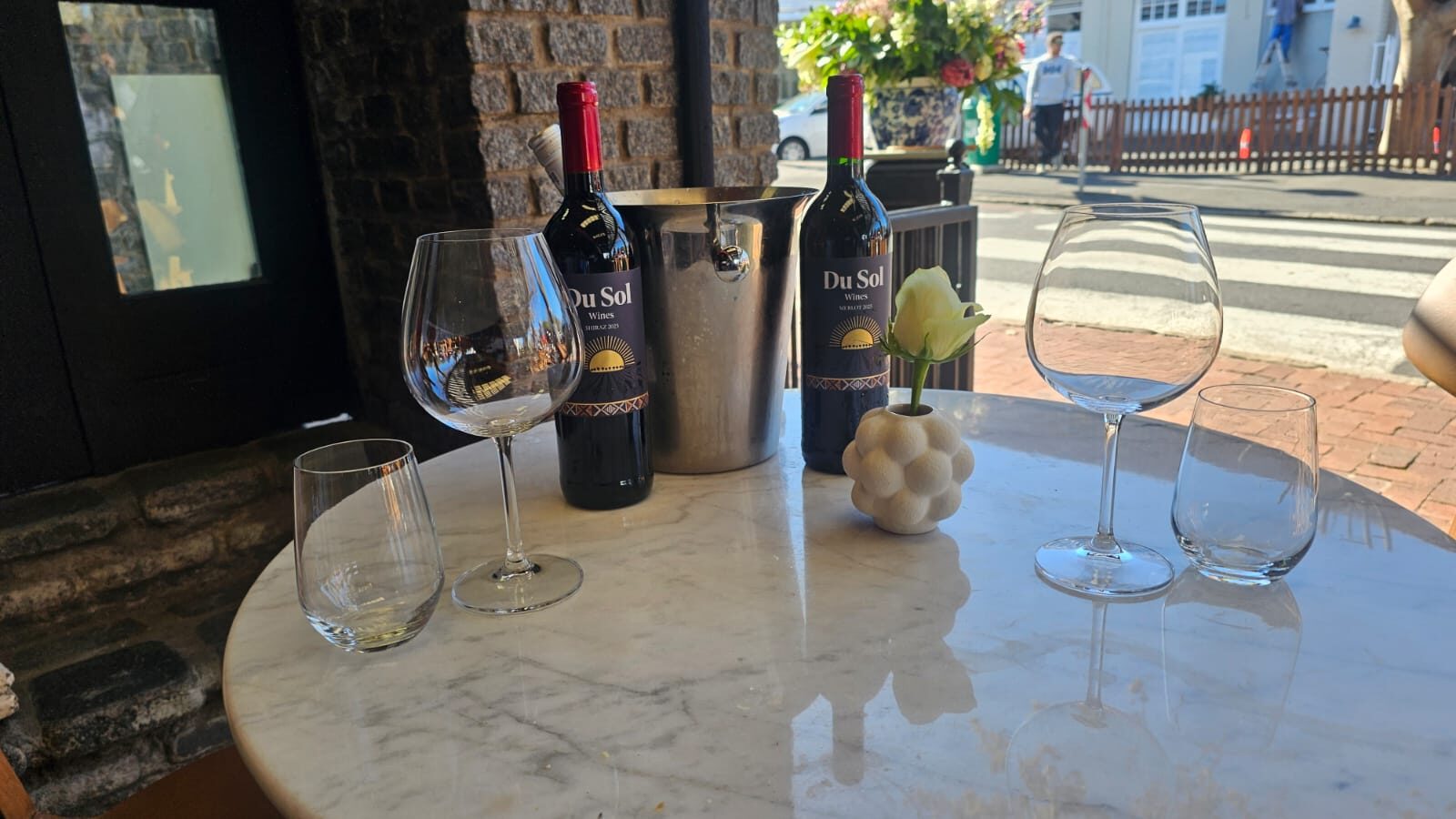 Du Sol Shiraz and Merlot on a marble table at Culture Wine Bar