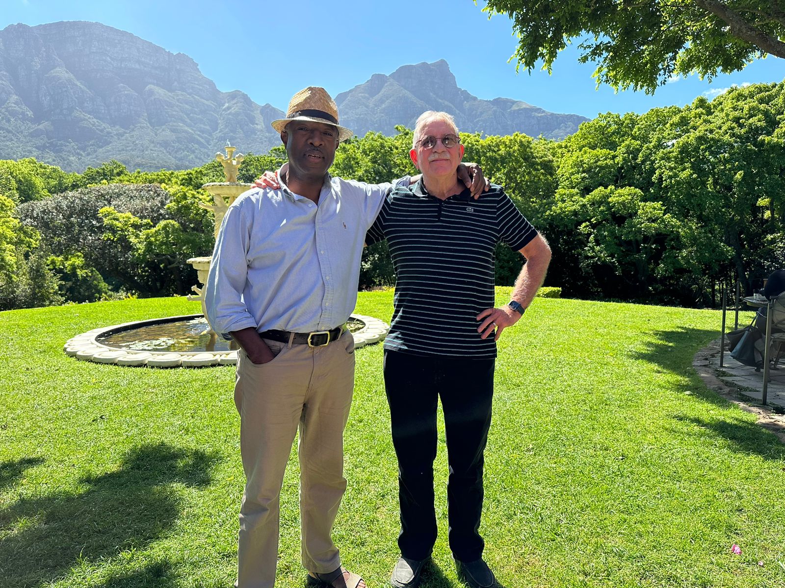 Friends together with the mountain behind